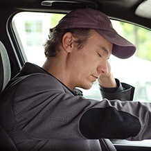 Man falling asleep behind the wheel