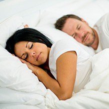 Man and woman sleeping soundly