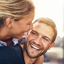 Woman and man laughing together