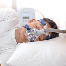 Man with CPAP mask sleeping