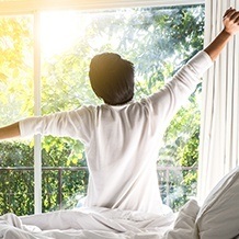 Man waking feeling refreshed