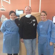 Dr. Hutto and two team members smiling together