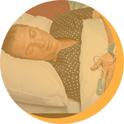 Man taking at home sleep test highlighted