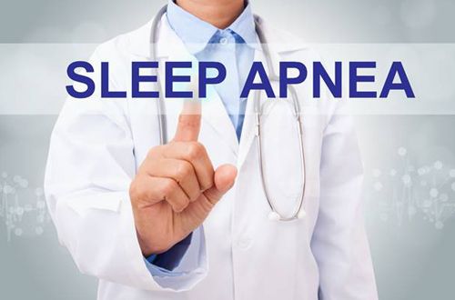 Sleep apnea in stylized lettering in front of dentist