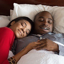 Man and woman sleeping soundly