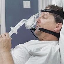 Man with CPAP mask in place